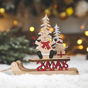 Wooden Christmas sleigh ornament with reindeer, tree and XMAS text on white snow background
