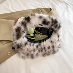 Plush leopard print crescent handbag for women showing interior storage space and texture