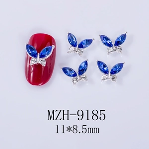 Detailed view of dark blue marquise rhinestone butterfly nail charms sized 11x8.5mm