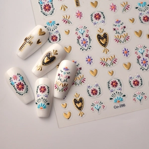 Bohemian floral nail stickers set with embossed gold crosses and colorful flower totems