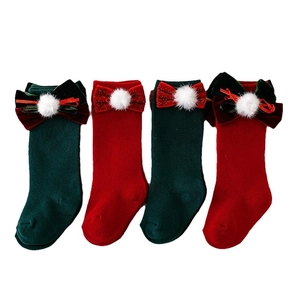 Spanish style Christmas baby high socks with large velvet bows and festive white pom-poms