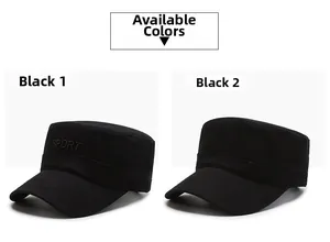 Detail view of two black cotton flat top caps with SPORT embroidery and reinforced stitching
