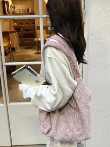 Pink plush faux fur tote bag for women showing a stylish soft oversized shoulder bag