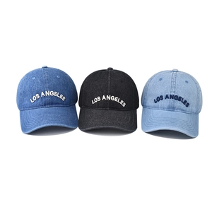 Three washed denim Los Angeles baseball caps in black, medium blue, and light blue colors