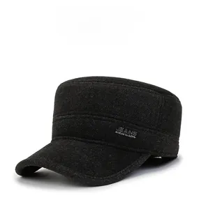 Detail of grey cadet cap featuring winter wool texture and side metal decorative badge