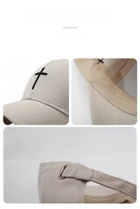 Macro detail of cross embroidery and adjustable metal buckle on beige cotton baseball cap