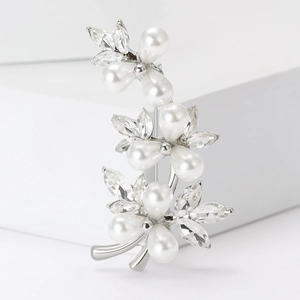Detail view of flower bouquet brooch with white pearls and marquise crystals