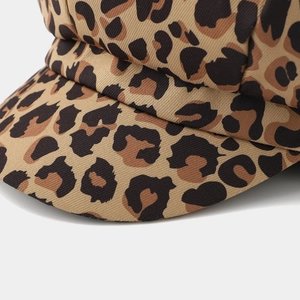 Detailed close-up showing the leopard print fabric and stitching on this stylish baker boy hat