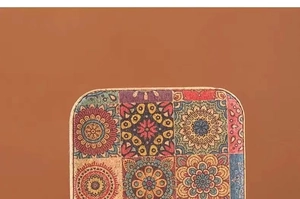 Detail of bohemian cork jewelry box featuring colorful mandala patterns and natural wood texture