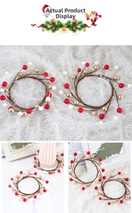 Christmas candle rings with red gold and white berries on woven twig base for holiday decor