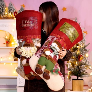 Detail of large festive Christmas stockings with 3D Santa Claus and Snowman doll figures