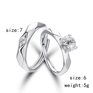 Detailed view of S925 silver couple rings with geometric facets and round cut diamonds