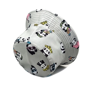 Macro detail of grey cotton bucket hat featuring all-over cartoon panda print pattern