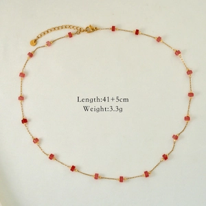 Detail view of 14K gold plated stainless steel necklace with red and pink beads