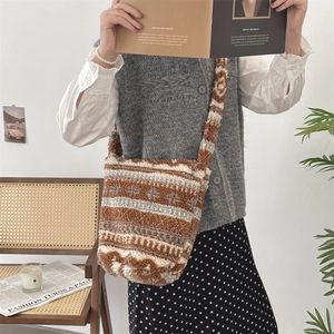 Macro view of plush bucket bag featuring brown and grey vintage geometric leopard patterns