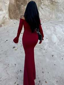 Back view of a deep red off-shoulder mermaid dress with elegant flared sleeves