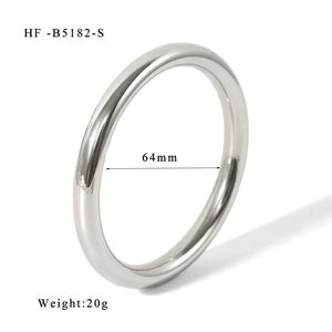 Detailed view of silver stainless steel bangle with 64mm inner diameter measurement