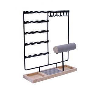 Black metal jewelry organizer with wooden base for earrings, necklaces and watches