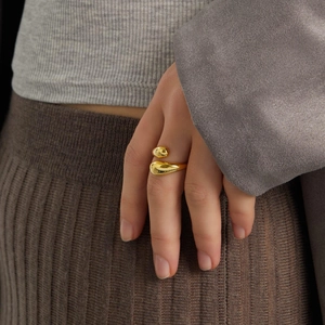 Close-up of 18k gold-plated stainless steel teardrop ring worn on a finger