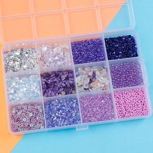 Top view of 12-slot kit with colorful glitters, faux pearls and craft sequins