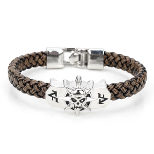 Brown braided rope bracelet with a vintage silver skull head metal charm closure