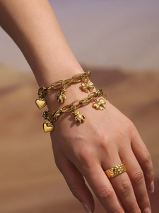 Chic gold-tone charm bracelets with bear, heart motifs and a hammered texture ring detail