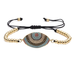 Adjustable evil eye charm bracelet with gold beads and colorful micro-set cubic zirconia