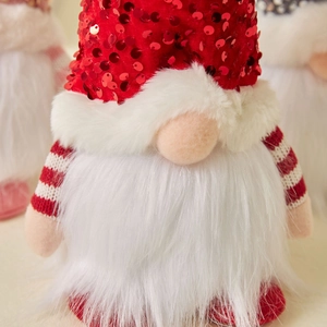 Christmas faceless gnome with red sequined hat and striped arms for holiday decoration