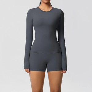 Detail of high-stretch double-sided brushed fabric on grey yoga long sleeve and shorts set