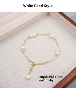 Detailed view of a gold pearl bracelet with a 4cm extension chain in a jewelry box