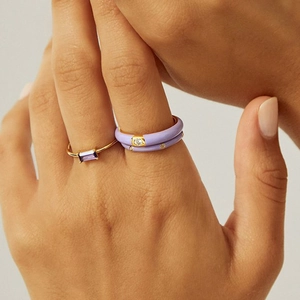 Set of three trendy lavender enamel and gold rings with purple gemstones for women