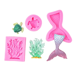 Detail of pink silicone sea animal molds showing turtle, coral and mermaid tail shapes