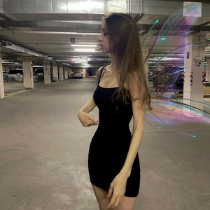 Detailed side view of black bodycon mini dress featuring stylish butterfly effect wing