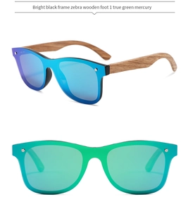 Detail of bamboo wood sunglasses with bright black frame and colored mercury lenses