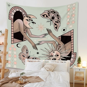 Detail of bohemian mandala tapestry featuring sun, moon and butterfly mystical patterns