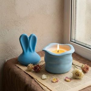 Pastel blue rabbit ear ceramic aromatherapy candle jar with matte finish and lid