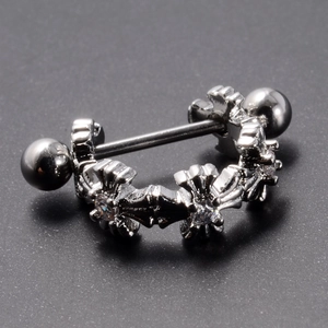 Macro shot of stainless steel barbell stud earring with cross pattern and inlaid zircon