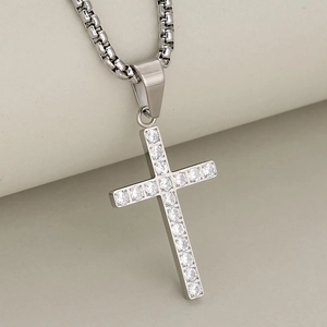 Minimalist silver cross pendant necklace with sparkling cubic zirconia on a box chain