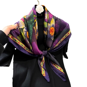 Vintage 90x90cm floral silk scarf in purple and orange draped over a black knit top