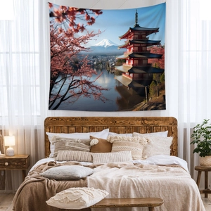 Detailed Mount Fuji tapestry featuring red pagoda and cherry blossoms on a cozy bedroom wall