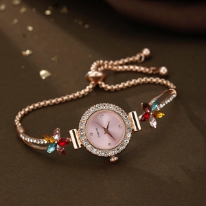 Rose gold quartz bracelet watch with pink floral dial and sparkling rhinestone accents