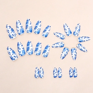 Blue and white porcelain style almond press-on nails with floral ink painting art design