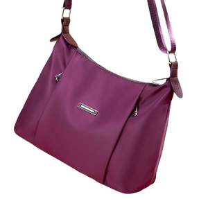 Purple waterproof nylon crossbody bag for women with spacious minimalist crescent design