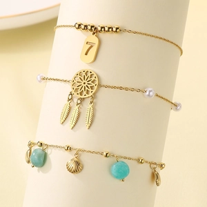 Gold layered anklet set with shell, dreamcatcher, and pearl charms for women