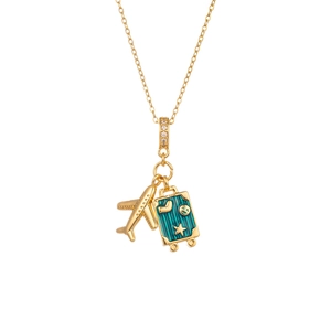 Golden airplane and turquoise enamel suitcase travel pendant necklace on white background