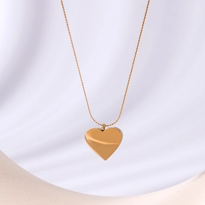 18k gold plated stainless steel necklace featuring a 3D heart pendant on soft fabric