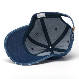 Navy blue denim baseball cap with letter C embroidery and distressed brim on white background