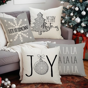 Set of 4 grey and white Christmas linen pillow covers featuring festive snowflake prints