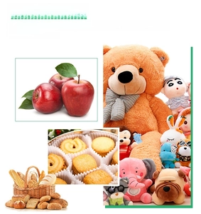Detail of Christmas gift box usage with apples, cookies and plush toys for holiday