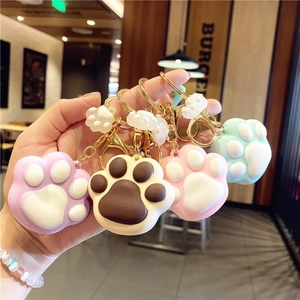 Cute PVC cat paw keychains in purple, brown, pink and blue with gold lobster clasps